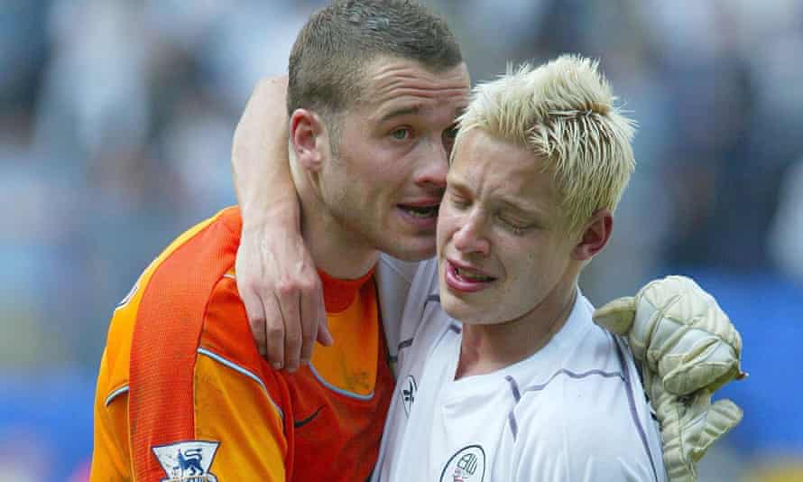 A tearful Alan Smith is consoled by Paul Robinson after a 4-1 defeat at Bolton in May 2004 meant were Leeds relegated.