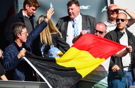 Noel Gallagher celebrates with a Belgian Flag given to him by Vincent Kompany.
