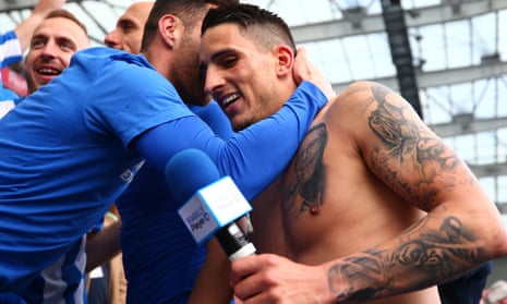 Brighton & Hove Albion’s Anthony Knockaert celebrates in the stand with team-mates after the win over Wigan as good as confirmed their promotion to the top flight after 34 years.