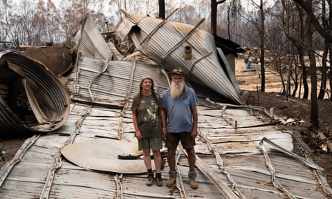 Patto and Gino McDonald with wrecked house.