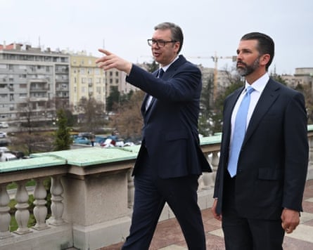Aleksandar Vučić points to the Belgrade skyline as Donald Trump Jr looks on