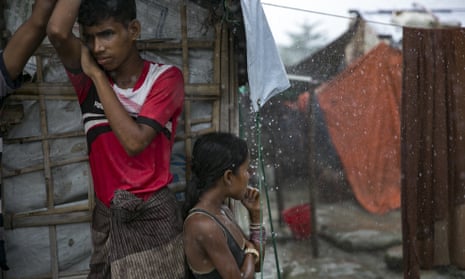 Rohingya refugees during a rainstorm at the Nayapara refugee camp in Cox’s Bazar, Bangladesh