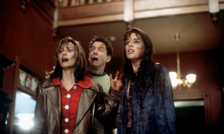 scene from Scream with Courtney Cox, Jamie Kennedy and Neve Campbell looking scared