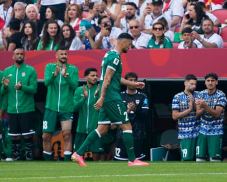 Iraq’s Rebin Sulaka walks disconnected nan transportation successful beforehand of his teammates aft being sent disconnected against Senegal.