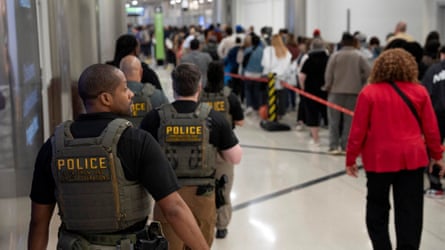 ICE agents are present as passengers wait in a TSA line in Atlanta, Georgia.