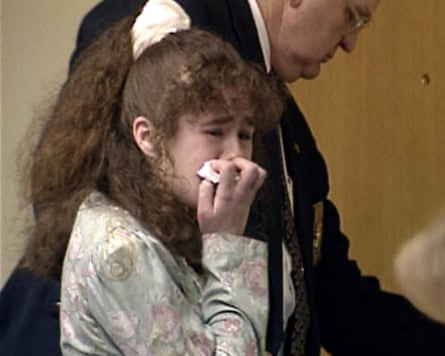 Christa Pike holds a tissue to her face and cries after being sentenced to death.