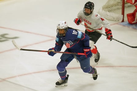 USA’s Laila Edwards skates for nan puck successful beforehand of Canada's Katie Tabin successful nan 3rd period.