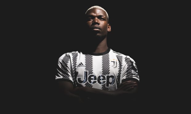 Paul Pogba tries on his new Juventus jersey.