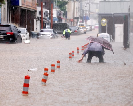 Death toll grows from torrential rains in South Korea with thousands unable  to return home | South Korea | The Guardian