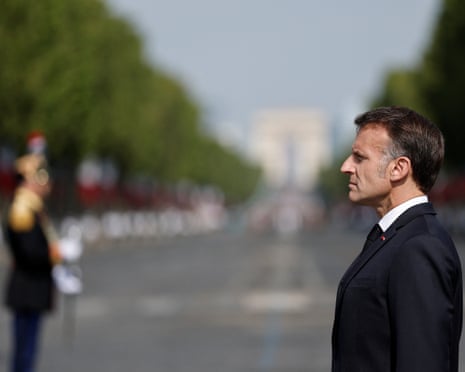 French president Emmanuel Macron reviews the troops on the Place de la Concorde during the annual Bastille Day military parade in Paris, France.