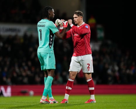 Arthur Okonkwo of Wrexham fist pumps Callum Doyle