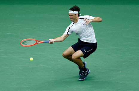 Taylor Fritz fires a forehand return to Darwin Blanch.