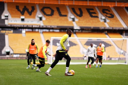 Toti Gomes of Wolves runs with the ball during the Halloween open training session