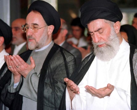 Ali Khamenei (left) prays with Mohammad Khatami in 1999