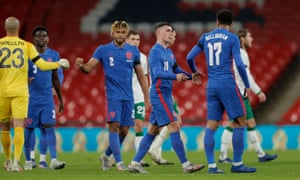 The England players, including Jude Bellingham and Phil Foden, celebrate their win after the final whistle.