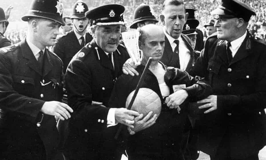 World Cup quarter-final, 1966, Wembley Stadium, German referee Kreitlin is escorted off the pitch by police