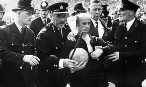 World Cup quarter-final, 1966, Wembley Stadium, German referee Kreitlin is escorted off the pitch by police
