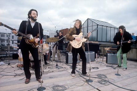 The Beatles playing their final live performance together on the roof of Apple records in London, January 1969.