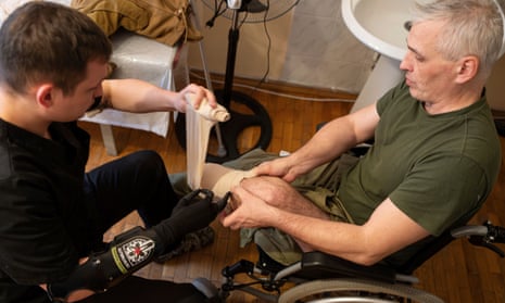 Dr Alexis Cholas, left, bandages an amputated limb of Serhiy Hohdan, a Ukrainian soldier at the hospital’s rehabilitation centre in Kyiv, Ukraine.