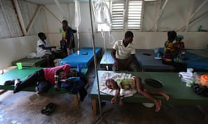 People with cholera symptoms receive medical care in Saint Antoine hospital in Jérémie on Thursday.