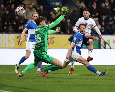 Aaron Collins fires in Bolton’s third goal against Birmingham to seal a rare defeat for the runaway leaders.