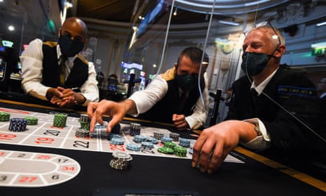 Staff wearing masks run through a game of roulette at The Rialto casino in central London as they prepare for reopening.