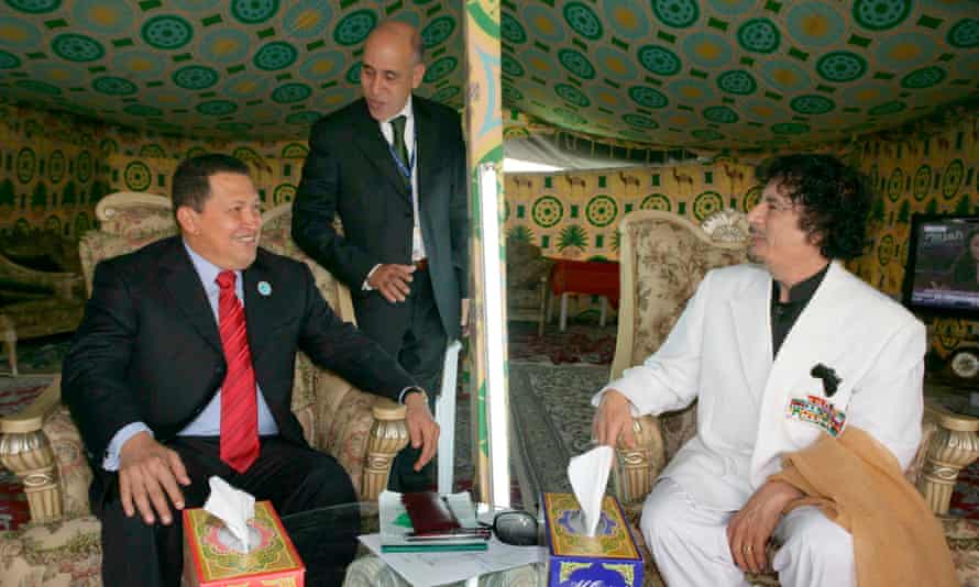 Hugo Chavez sits with Muammar Gaddafi inside his tent before a summit in Doha in 2009