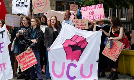 Students holding banners in support of university staff