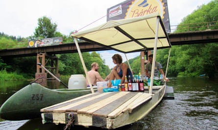 A floating bar serves a passing canoeist.