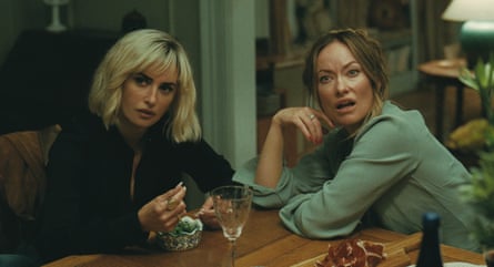 Two women looking sceptical at the kitchen table