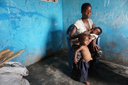 Rebecca, 17, with her two children in Nyanyano. Her children are malnourished and frequently ill