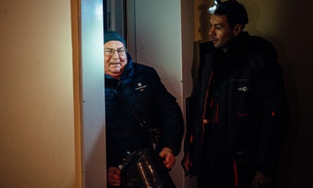 Mykola Bezruchenko, 71, is rescued after spending an hour stuck in the elevator of a residential building in Kyiv.