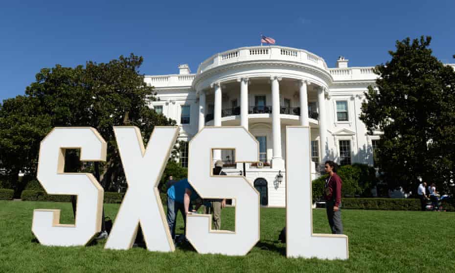 The South By South Lawn logo rests on the South Lawn of the White House in Washington DC on Monday.