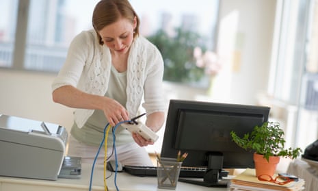 woman installing router at home office