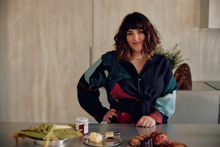 Julia Busuttil Nishimura stands in front of a table with ingredients