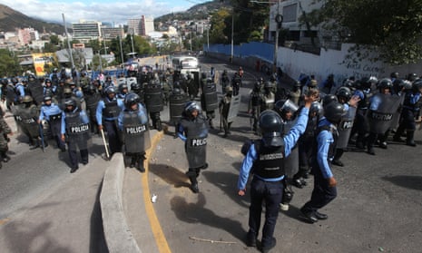 Security forces take positions to block demonstrators during a protest against the re-election of Honduras’ President Juan Orlando Hernández in Tegucigalpa on Tuesday.