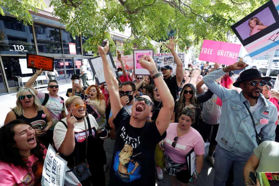 Supporters of Britney Spears celebrate after a judge suspended her father from the conservatorship.