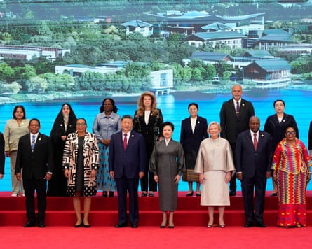 China’s president,Xi Jinping (centre left), and his wife, Peng Liyuan (centre right) with national leaders and delegates at the global women’s summit.