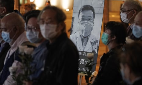 People attend a vigil for Chinese doctor and whistleblower Li Wenliang, in Hong Kong, on 7 February.