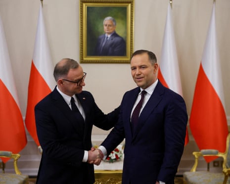 Poland's outgoing president Andrzej Duda meets with president-elect Karol Nawrocki at the Presidential Palace in Warsaw, Poland.