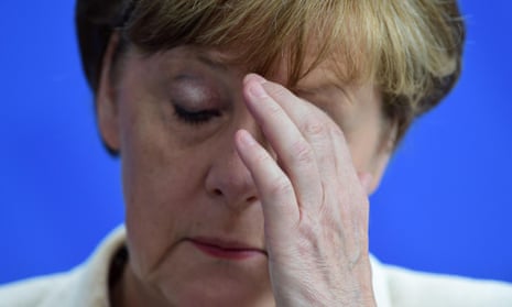 German Chancellor Angela Merkel reacts during a press conference