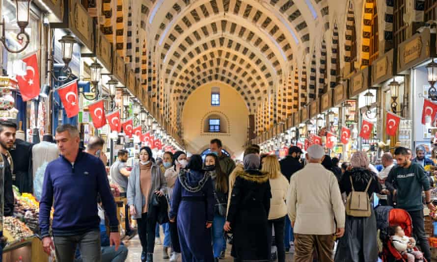 Shoppers in a market in Istanbul, as gold sellers see an increased demand as people try to offload the ailing Turkish currency.