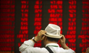 Hold onto your hat! A Chinese investor watches stocks rally in Beijing today.
