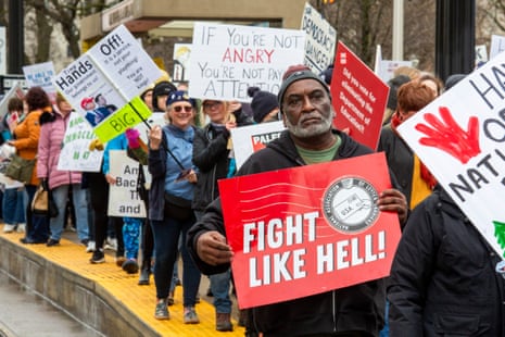 People protest against the Trump administration in Detroit, Michigan, on 5 April 2025.