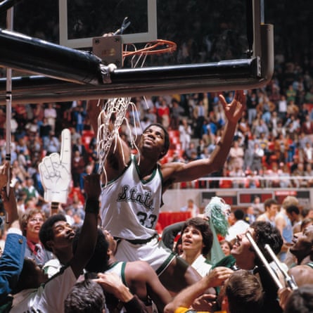 As guard for Michigan State, Johnson cuts down the net after winning a championship game in Salt Lake City in 1979.
