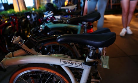 Brompton bicycles are folded and parked at the RE bike station in Beijing.
