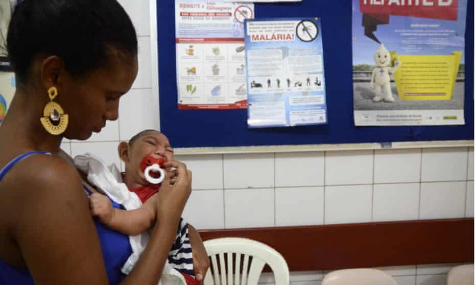 Zika virus outbreak, Brazil - 01 Feb 2016Mandatory Credit: Photo by Xinhua/REX/Shutterstock (5579897b) Gabrielly Santana da Paz holds her child who suffered microcephaly while waiting for examination at the Oswaldo Cruz Hospital, in Cabo de Santo Agostinho in northeastern Brazil Zika virus outbreak, Brazil - 01 Feb 2016