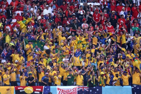 Tunisia and Australia fans show different emotions.