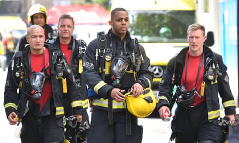 Firefighters at Grenfell Tower on the day of the disaster.