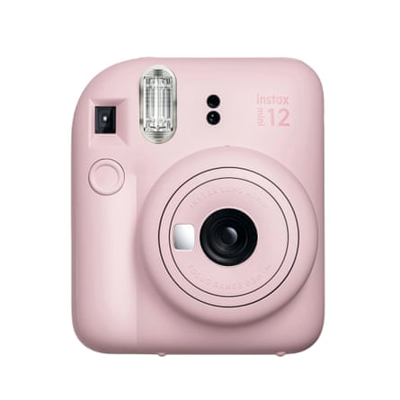 Fujifilm Instax Mini 12 instant camera with built-in flash and hand strap in blossom pink